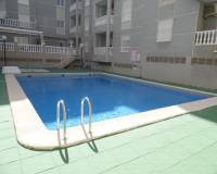 blue swimming pool with two bedroom apartment for sale guardamar