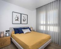 large bed in main bedroom in these new apartments for sale punta prima real estate guardamar