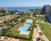 views overloiking the communal pool and gardens and sea views from this new penthouse for sale mil palmeras