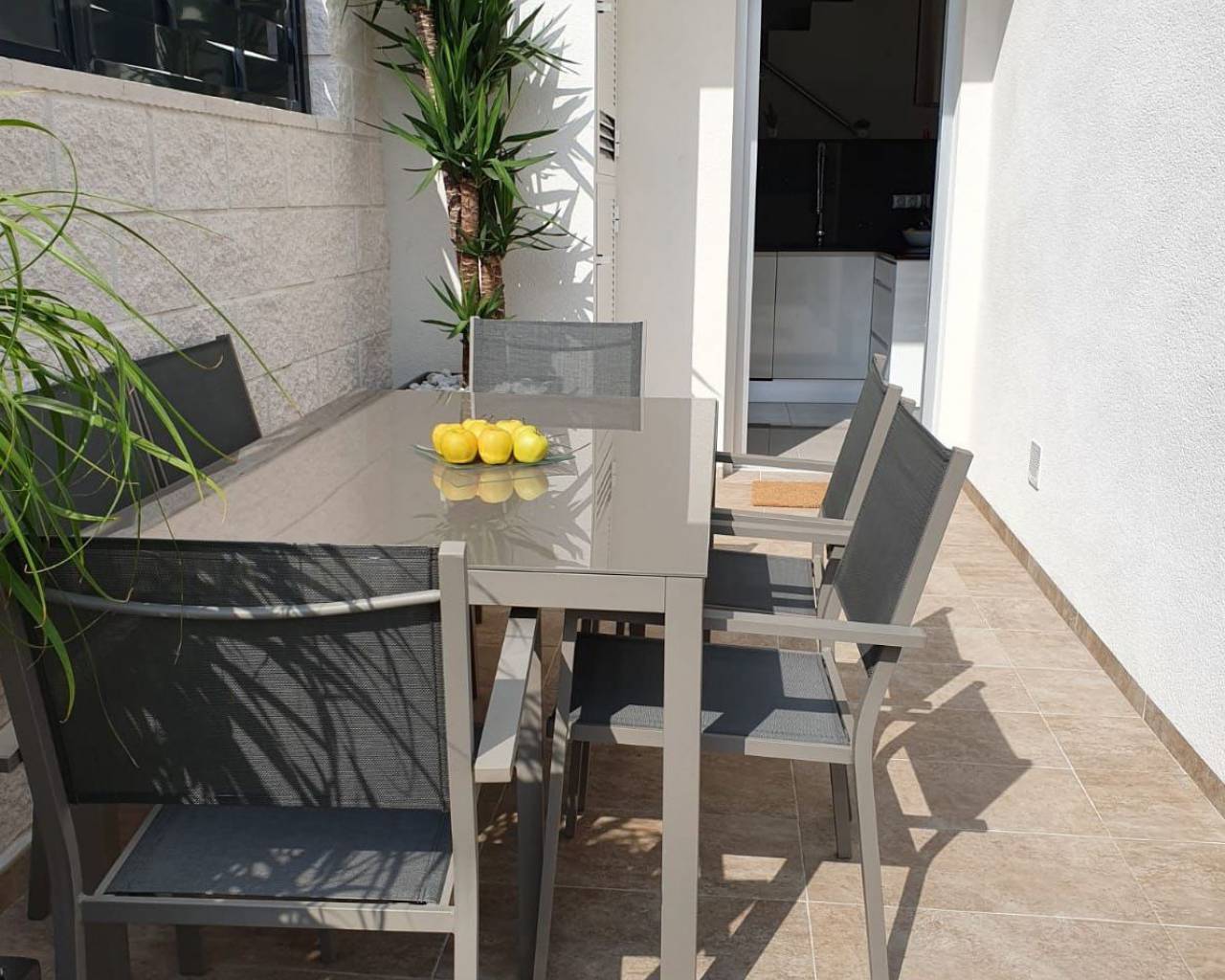 outside table on terrace of new villas for sale from zebra homes real estate