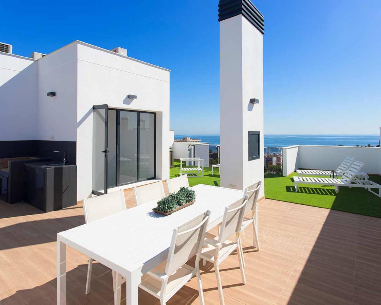 white table on large terrace for outdoor dinnig new penthouse for sale